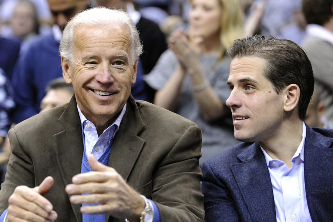 US Vice-President Joe Biden and son Hunter (right) appear at the Duke Georgetown NCAA college basketball game in Washington in 2010. Photo: AP