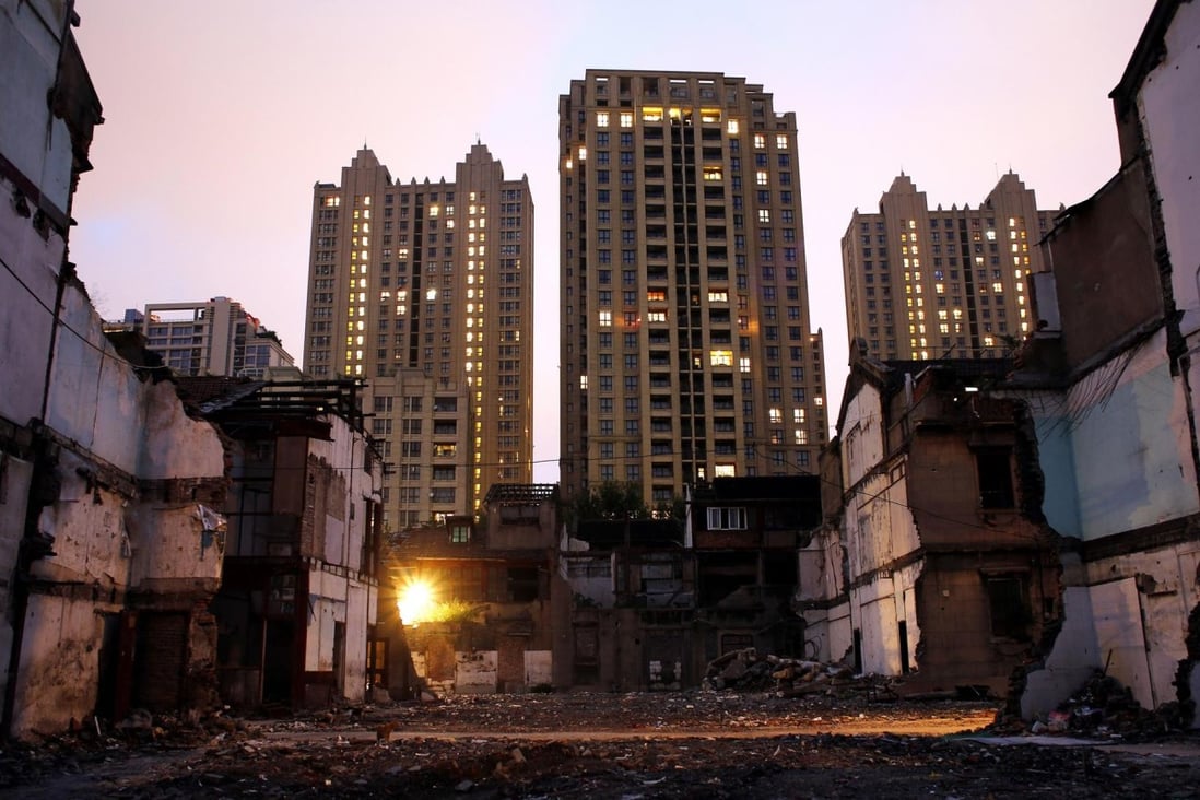Houses being demolished to make way for new homes in Shanghai even as prices fell for the fifth month across the mainland. Photo: Reuters
