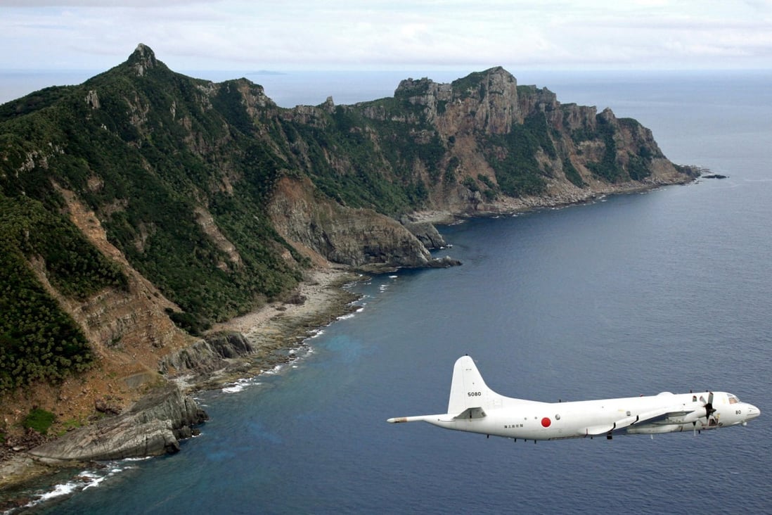 A Japanese surveillance plane flies over the Diaoyu Islands. Photo: AP