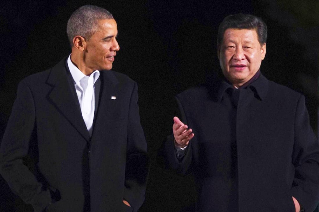 Presidents Barack Obama and Xi Jinping chat informally as they take a stroll at the Zhongnanhai leaders compound in Beijing before enjoying a private dinner. Photo: AFP