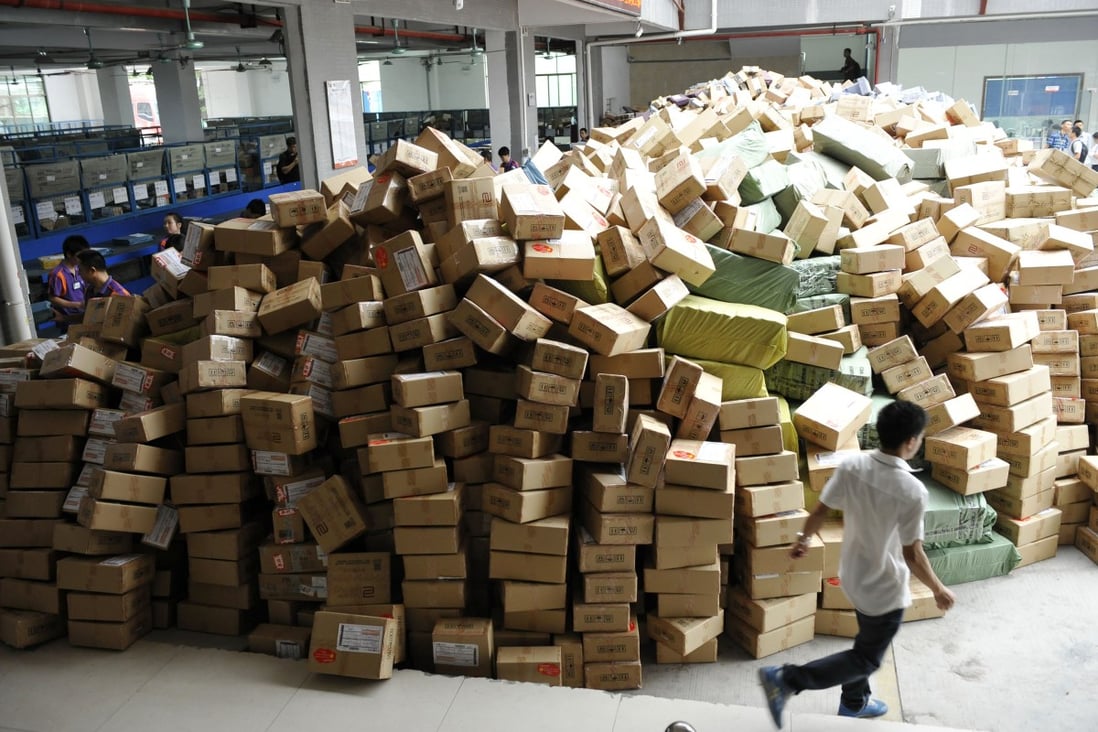 Packages pile up in a warehouse in Guangzhou. SF Express, the biggest private express logistics firm in China, is considering an expansion to Europe. Photo: Xinhua