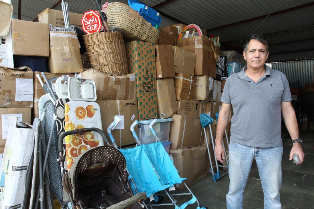 Remar's John Silva uses the organisation's truck to gather old furniture before restoring and selling them. Photo: May Tse