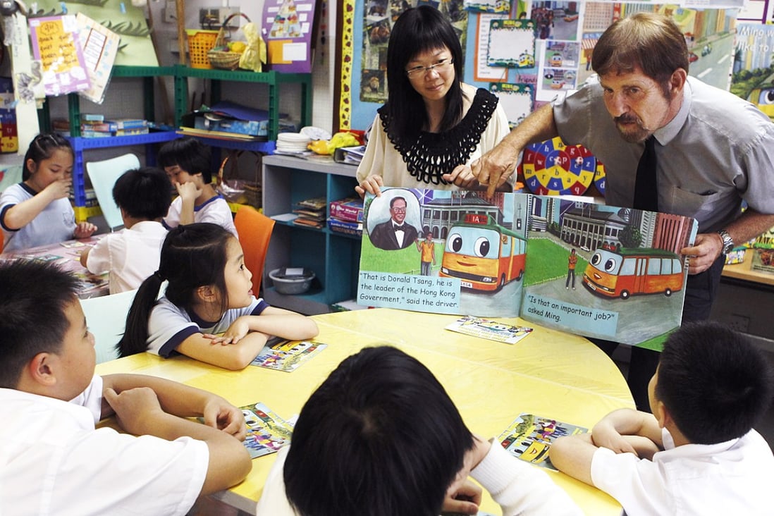 Teachers speak to students during an English lesson. Photo: SCMP