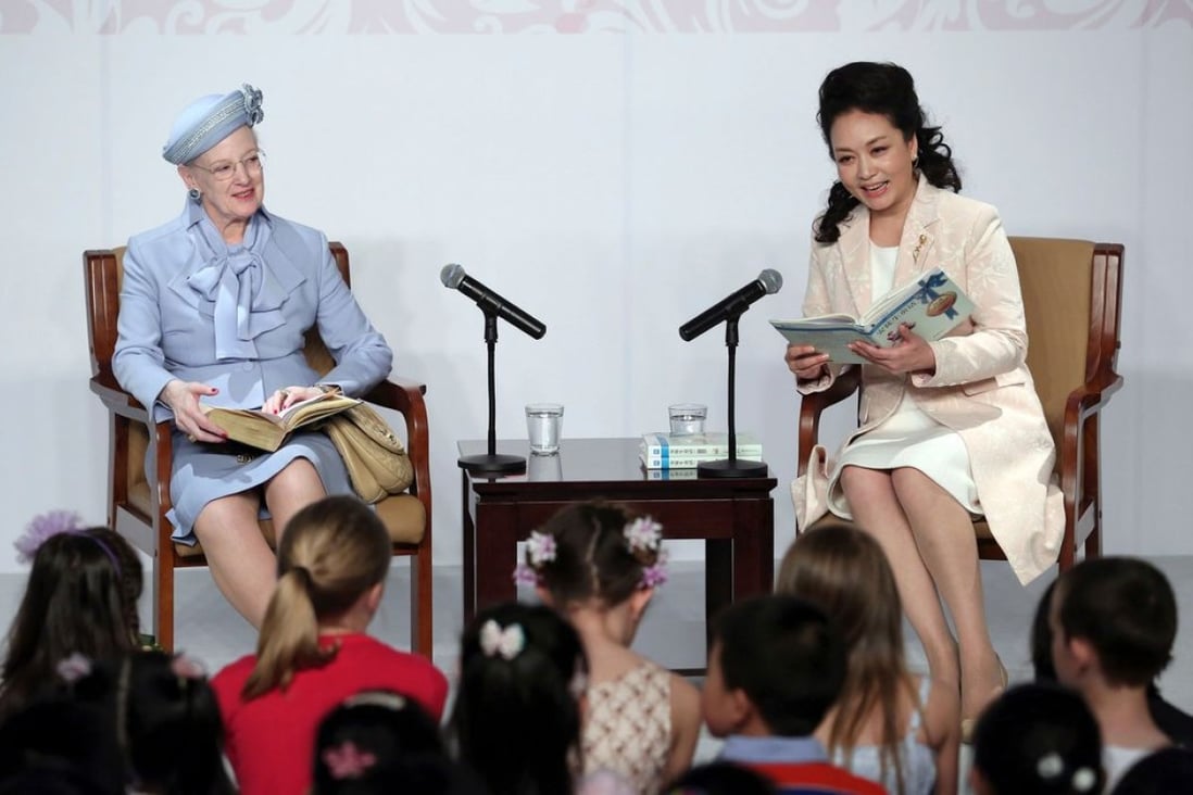 Denmark's Queen Margrethe II (left) read fairy tales with first lady Peng Liyuan during a visit to Beijing in April. Photo: Reuters