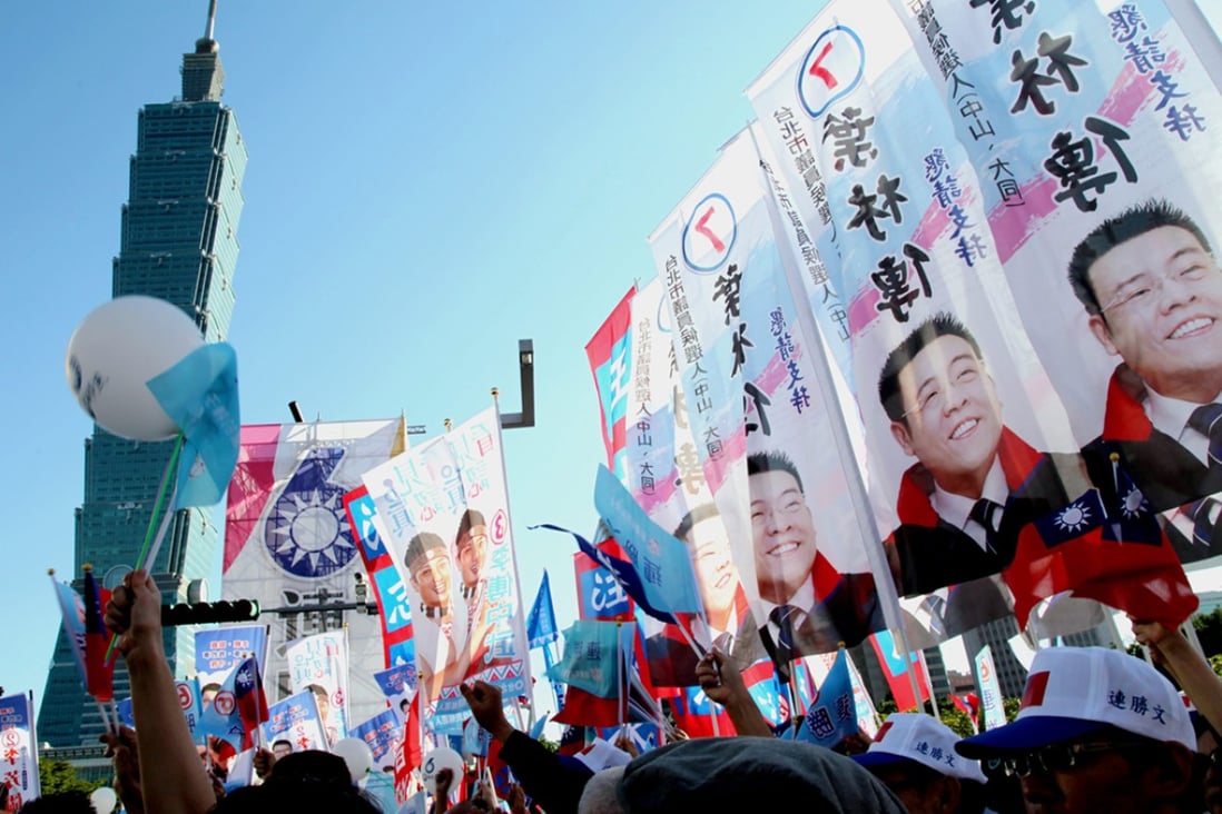 Supporters of Taiwan's ruling Chinese Nationalist Party (KMT) at a campaign rally ahead of local elections in Taipei.
