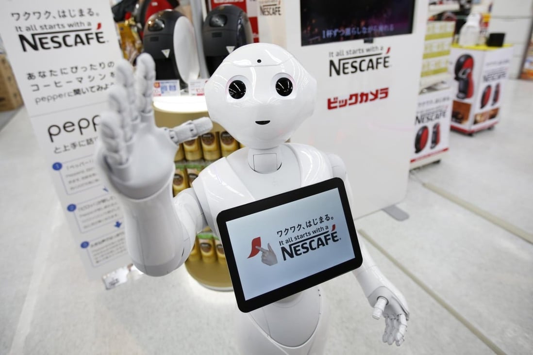 Robot "Pepper" introduces coffee machines. Photo: Reuters