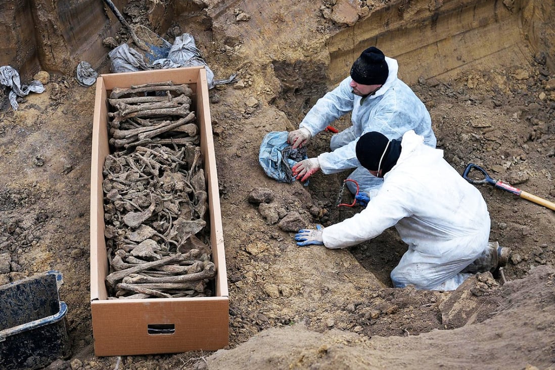 The remains of Soviet and Italian soldiers are uncovered. Photo: AFP
