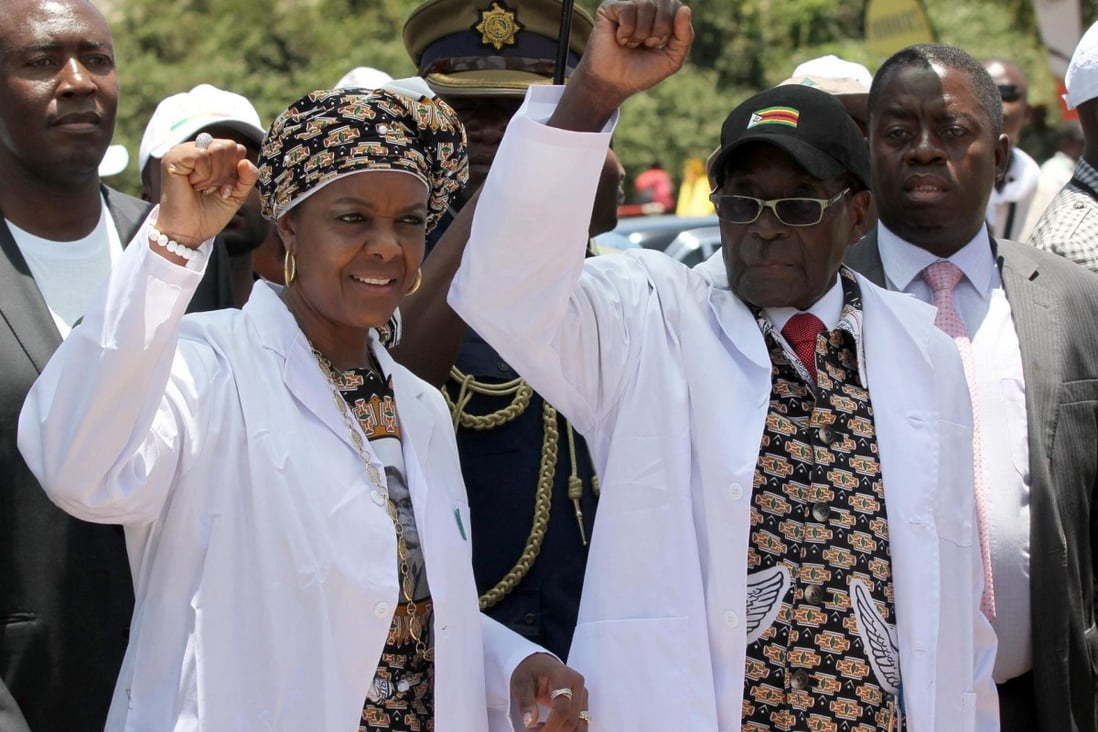 Zimbabwe President Robert Mugabe (right) with his wife, Grace, who has been elected to a top post as head of the ruling Zanu-PF party's women's wing. Photo: Reuters