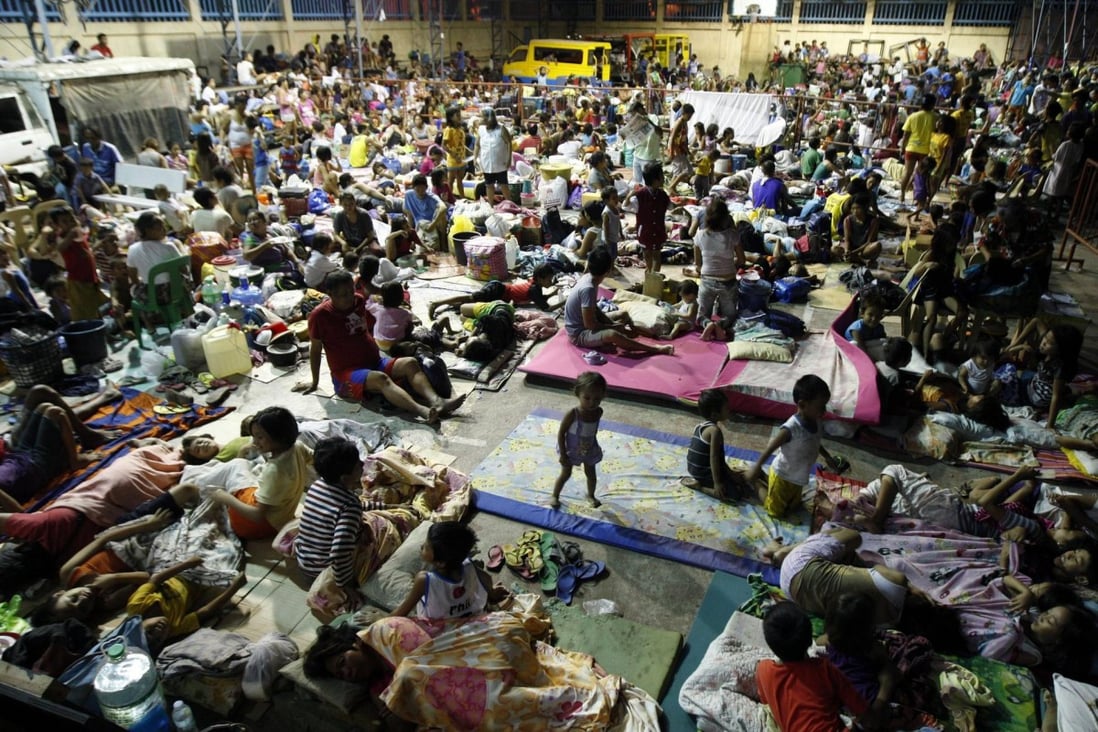 Filipinos take shelter inside a gymnasium in Mambaling village, Cebu province, some of the 600,000 who fled to safety as Typhoon Hagupit started battering the eastern Philippines yesterday. Photo: EPA
