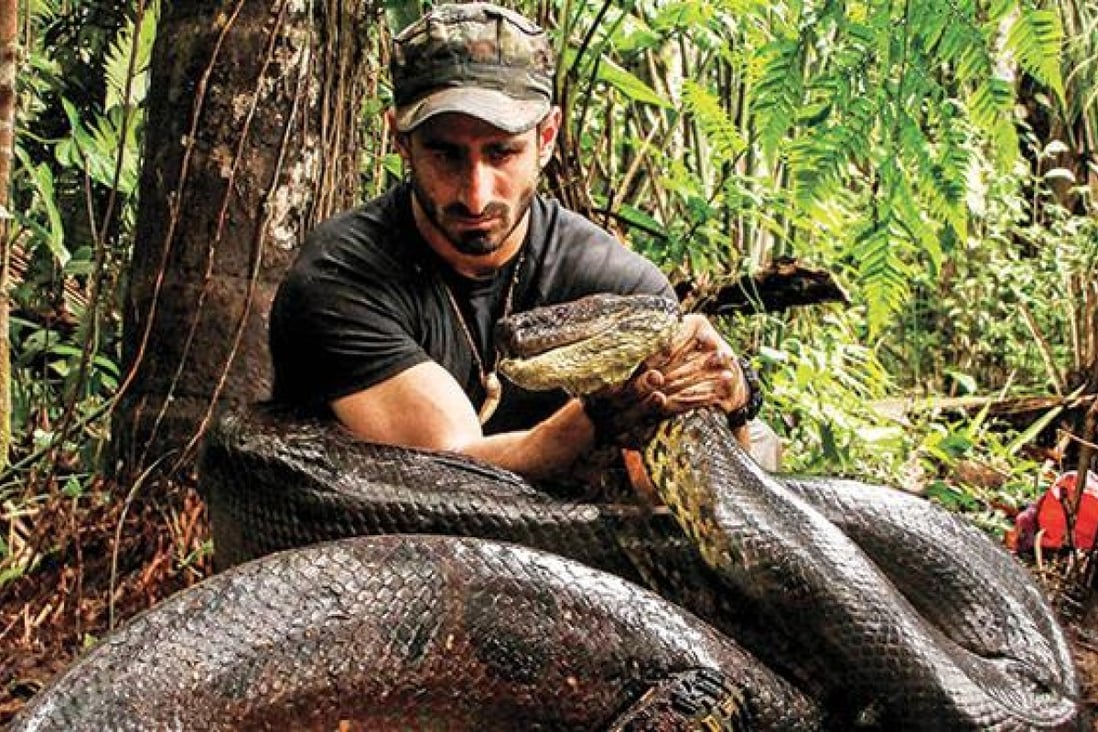 A photo provided by The Discovery Channel shows Paul Rosolie with the huge anaconda which later failed to swallow him whole. Photo: Handout 