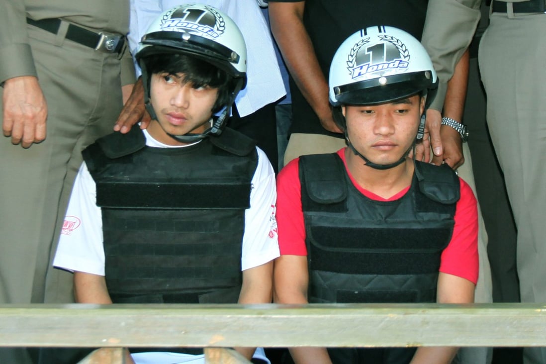 The Myanmar migrant workers Win Zaw Tun (left) and Zaw Lin (right) appear at a police press conference in Koh Tao island, Thailand. Photo: EPA