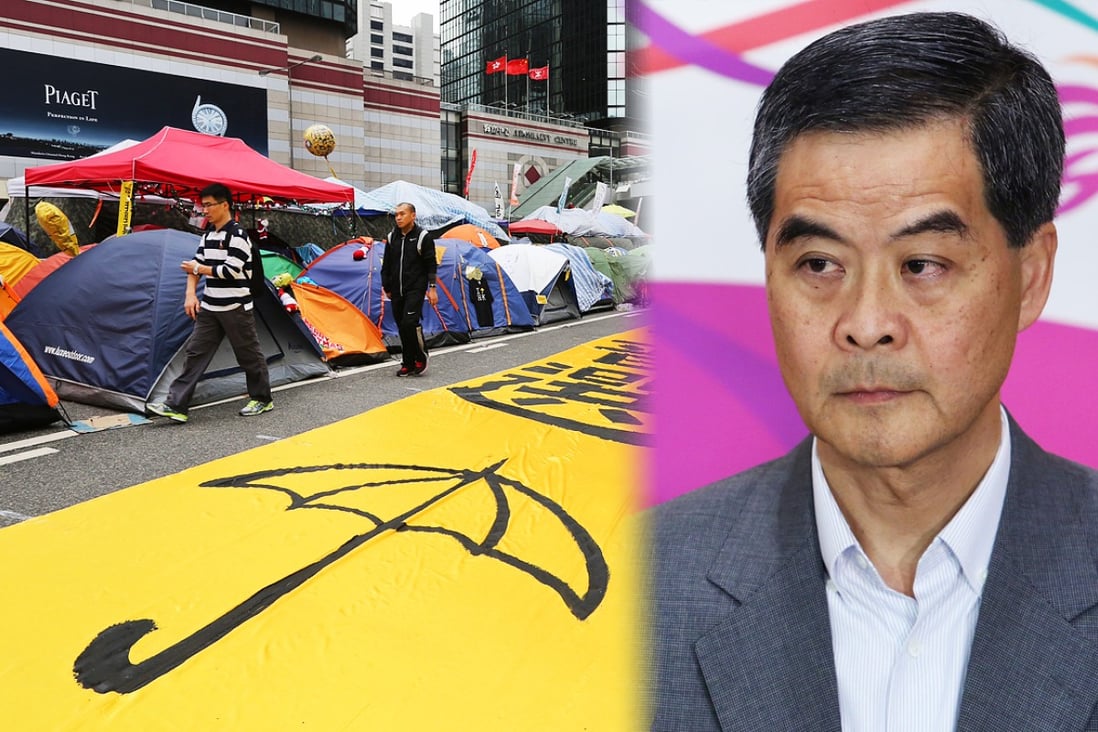 An image of a yellow umbrella is spread out on the road at the site of the Admiralty Occupy protest on December 7. Leung rejected a request by students to relaunch the constitutional reform process. Photos: Sam Tsang
