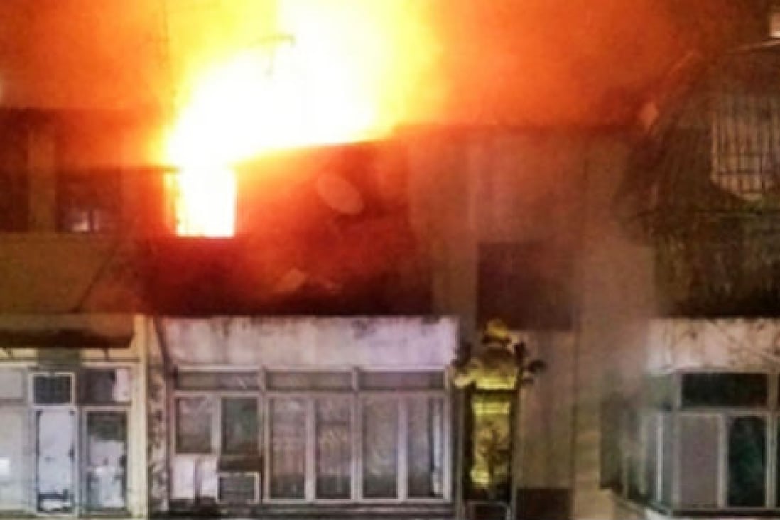 Police suspect a fire that broke out in a block of flats in Sham Shui Po on Sunday night was a case of arson. Photo: SCMP Pictures