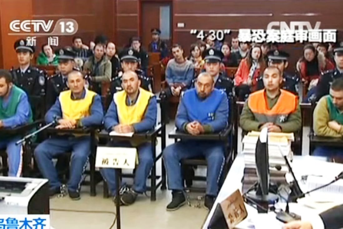 State television broadcast defendants listen to verdict. Photo: Screenshot via CCTV