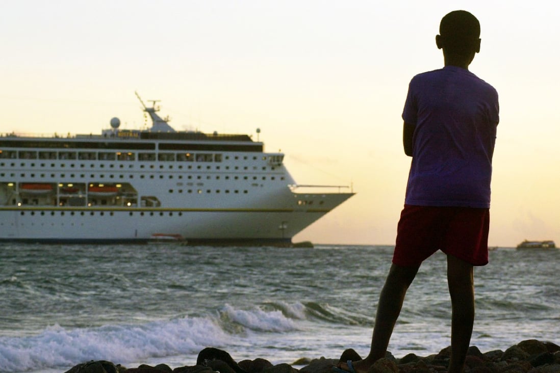 A cruise ship lies run around off the shore of the Caribbean island of Nevis in St. Kitts and Nevis in 2001. Photo: AP