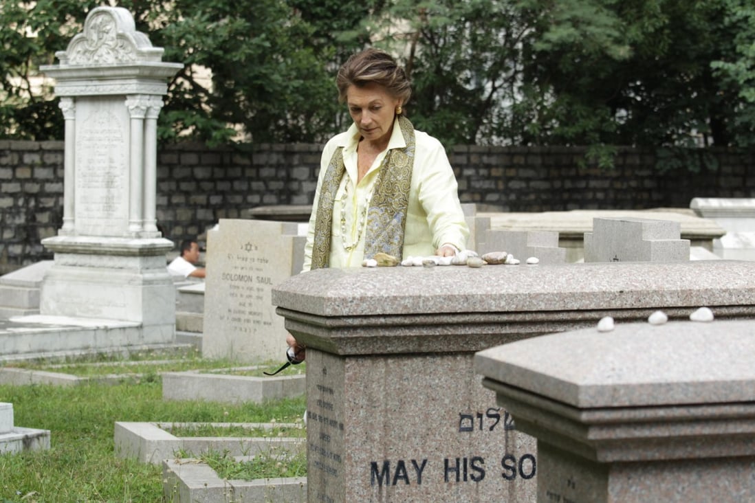 Judy Green places stones of remembrance on Lawrence and Horace Kadoorie's sarcophagi at the Jewish Cemetery in Happy Valley. Photos: Dickson Lee; The Hong Kong Heritage Project; Nora Tam