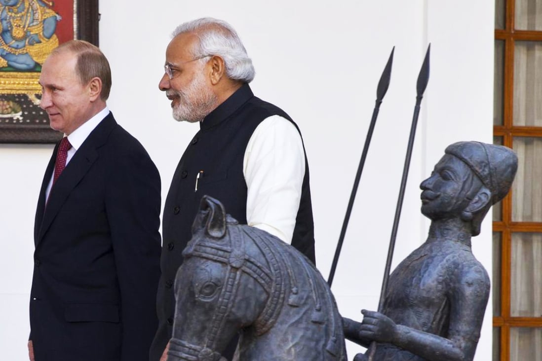 Indian Prime Minister Narendra Modi (front) meets with Vladimir Putin. Photo: AP