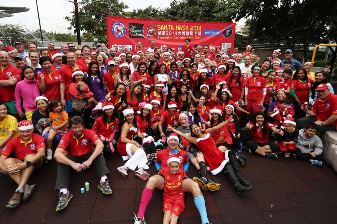 Participants in yesterday's hash run in support of Operation Santa Claus gather at Quarry Bay Park. The effort helped raise HK$75,000 for the needy. Photo: Jonathan Wong