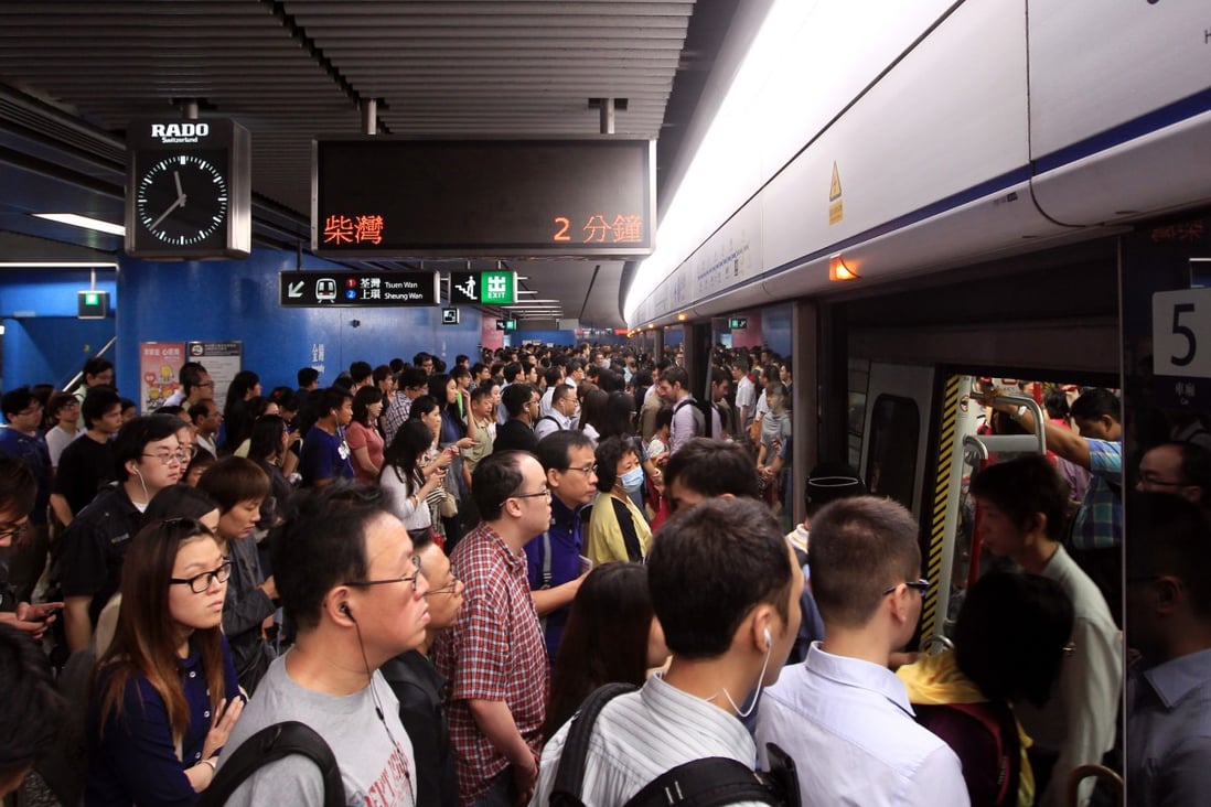 Some MTR commuters had to wait five minutes to enter stations this morning. Photo: Jonathan Wong