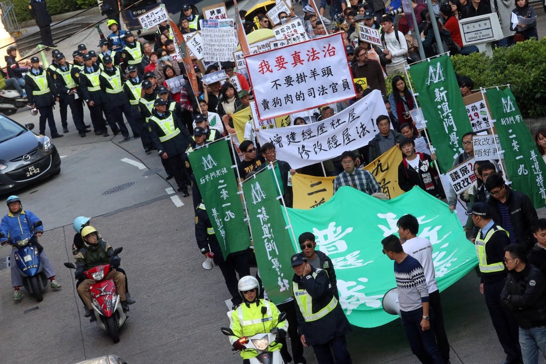 Pro-democracy locals march under police escort. Photo: K. Y. Cheng