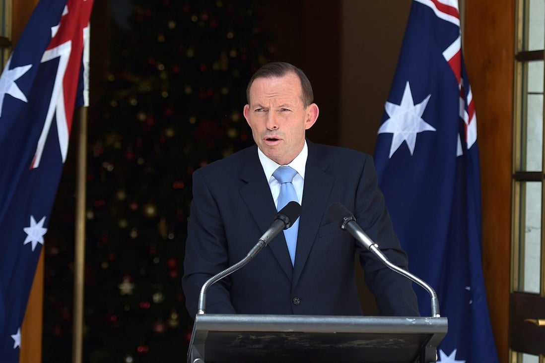 Tony Abbott gives details of his ministerial reshuffle at Parliament House in Canberra on Sunday. Photo: EPA