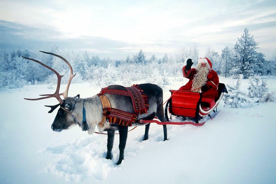 Santa Claus, pictured riding in his sleigh pulled by a reindeer in northern Finland. Photo: Reuters