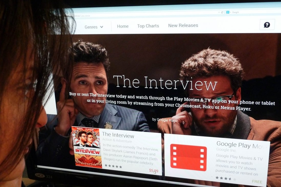 A woman looks at the Google Play purchase page for the Sony film "The Interview". Photo: AFP