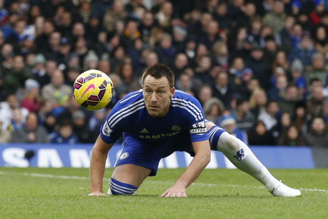 Chelsea's John Terry heads the ball back to his goalkeeper while on defensive duties against West Ham United at Stamford Bridge on Boxing Day. Chelsea maintained their 100 per cent home record in the league this season with a 2-0 win. Photo: AFP
