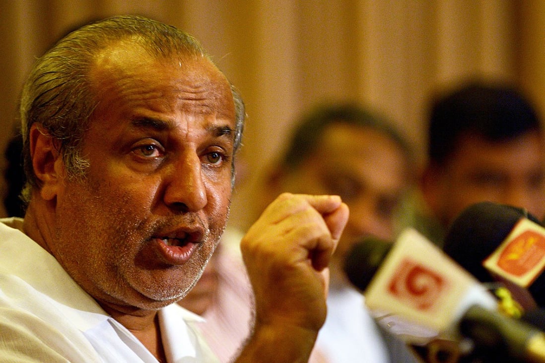Sri Lanka Muslim Congress leader Rauf Hakeem announces his resignation as justice minister and pledges support for opposition leader Maithripala Sirisena in January 8 elections. Photo: AFP 