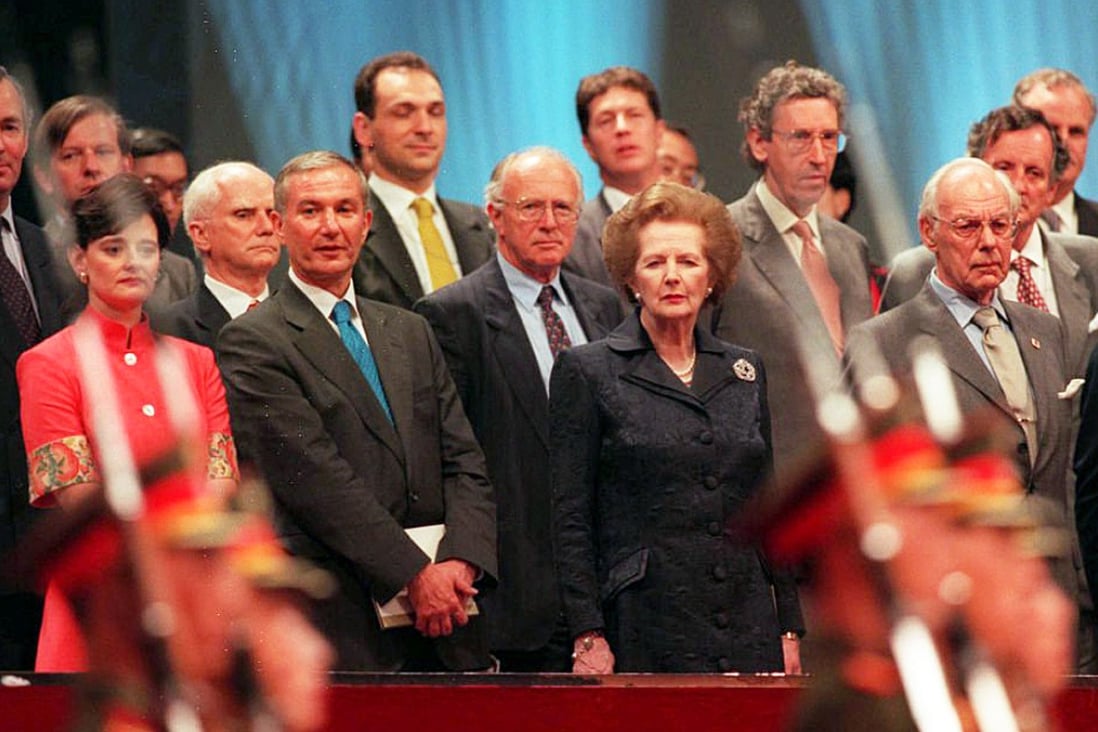 Former British prime minister Margaret Thatcher and husband Dennis (right) during the handover in 1997. Photo: AFP