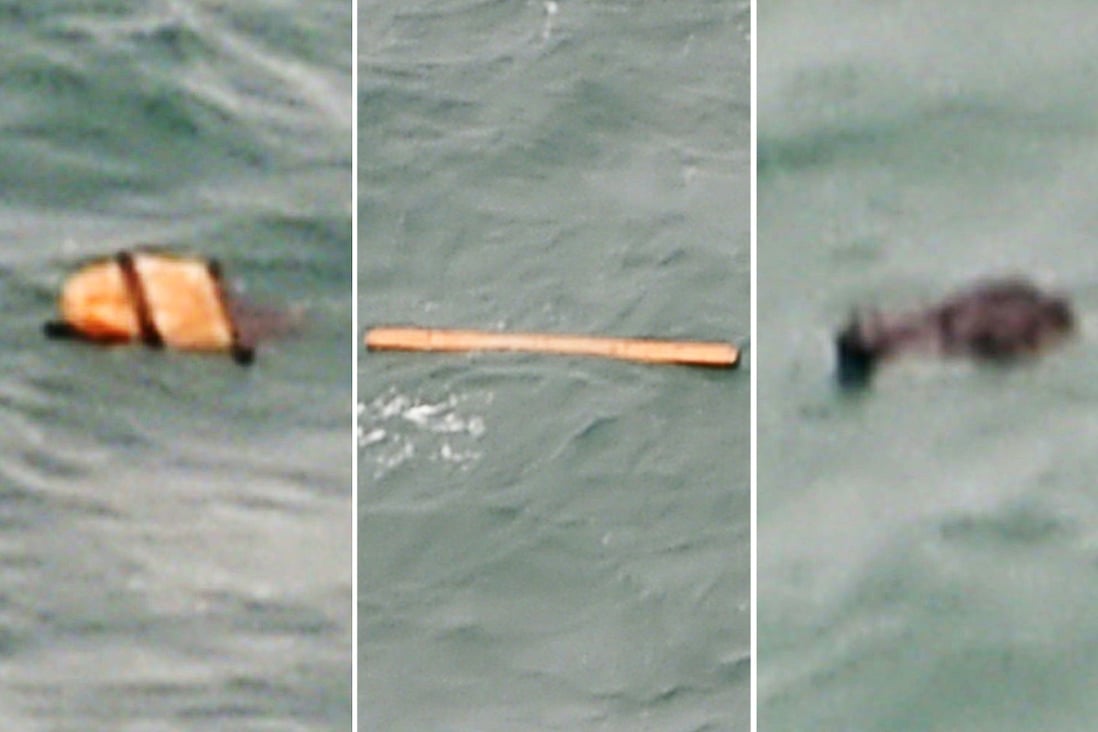 Pictures taken in the search for AirAsia flight QZ8501 appear to show debris floating in the water. Photo: AFP