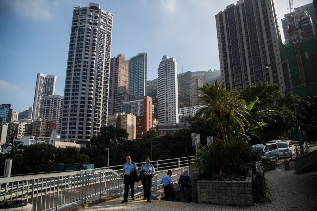 Residential apartments loom in Hong Kong as surplus government quarters spur interest from the city's heated property market. Photo: Bloomberg