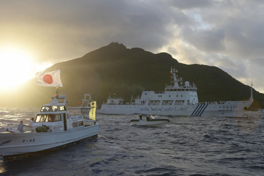 A Chinese marine surveillance ship (centre) sails near Japan Coast Guard vessels and a Japanese fishing boat at one of the disputed islands. Photo: Reuters