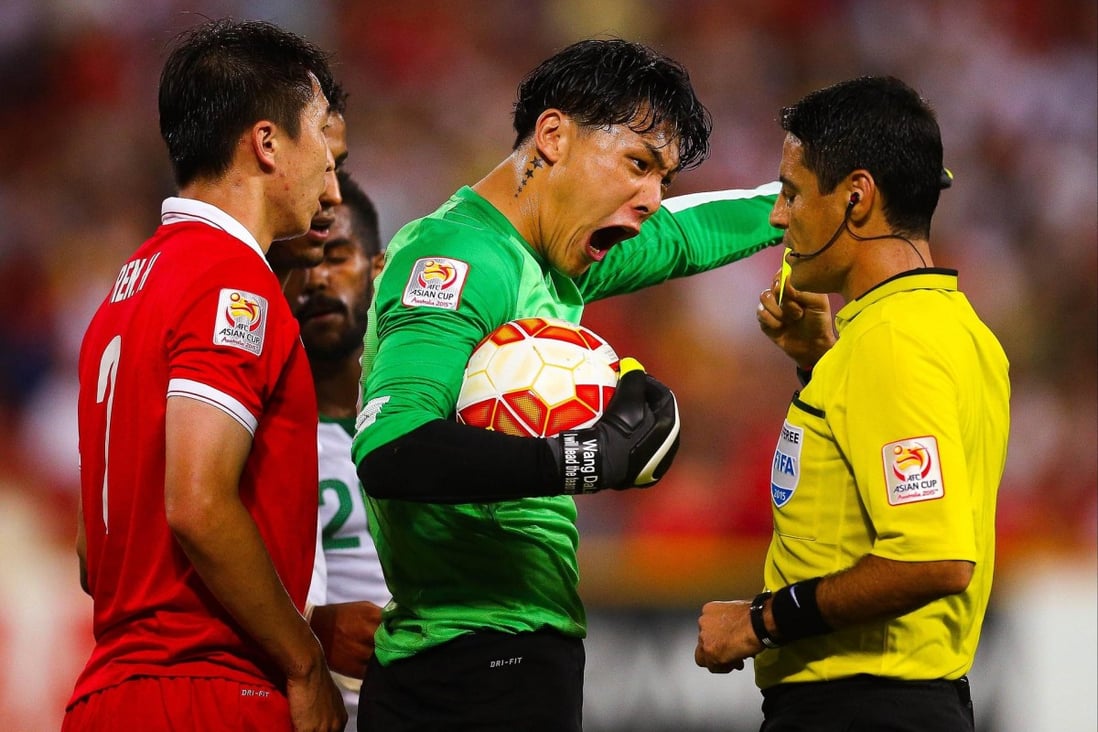 China's Wang Dalei shouts at referee Alireza Faghani in their match against Saudi Arabia. Photo: AFP