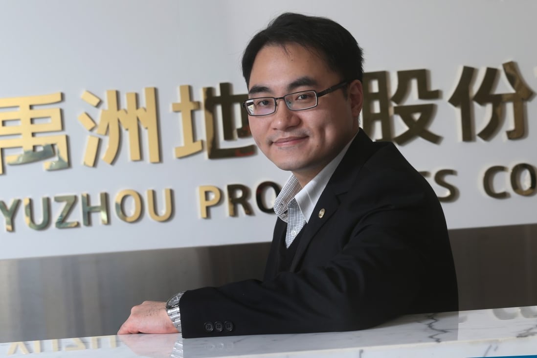 Yuzhou Properties chief financial officer Chiu Yu-Kang poses after an interview in his office, saying he is not in a hurry to grow the company. Photo: David Wong