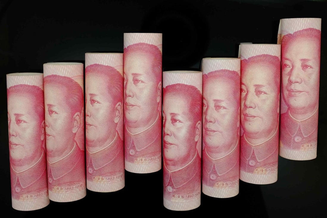 Rolls of 100-yuan notes as China's money supply M2 rose 12.2 per cent at the end of December, below market expectations. Photo: Reuters