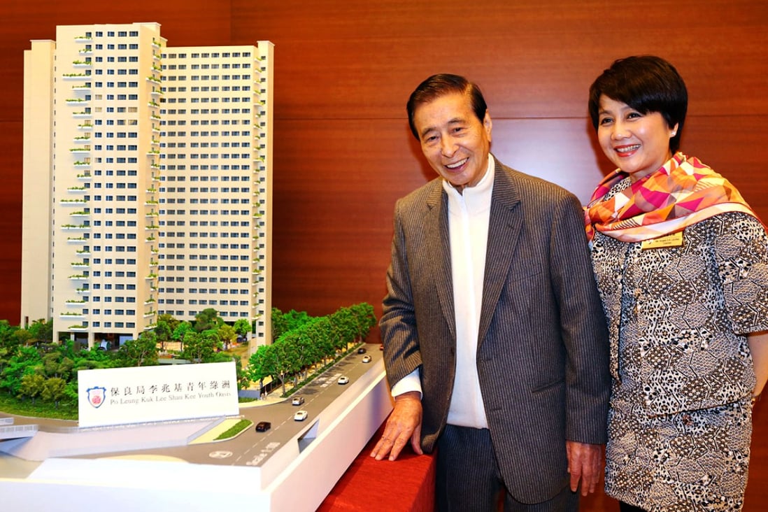 Lee Shau-kee and Angela Leong On-kei, the chairman of Po Leung Kuk, with a model of the hostel. Photo: Nora Tam