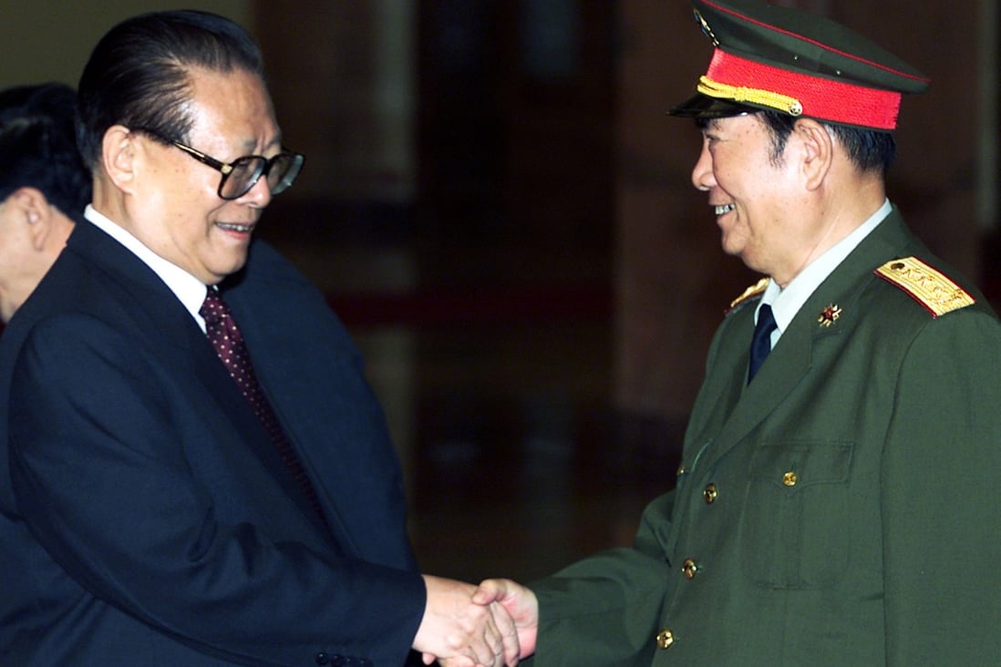 President Jiang Zemin (left) shakes hands with General Zhang Wannian in Beijing in 2002. Zhang was a protégé of Jiang. Photo: Reuters