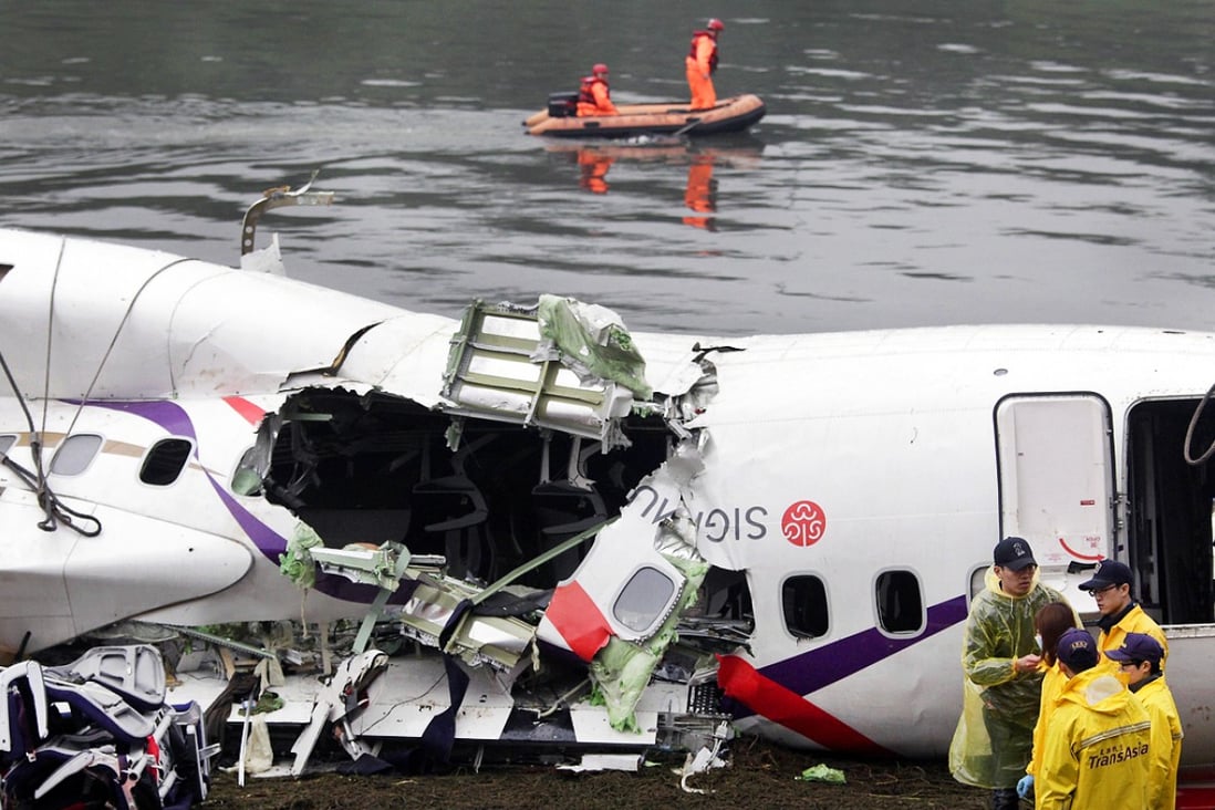 Members of a search-and-rescue team near the wreckage of the aircraft. Photo: AFP 