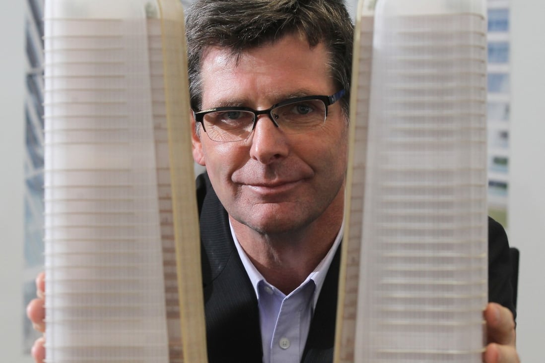 TFP Farrells director Stefan Krummeck poses with the model of the planned twin towers in Qianhai. Photo: Edward Wong
