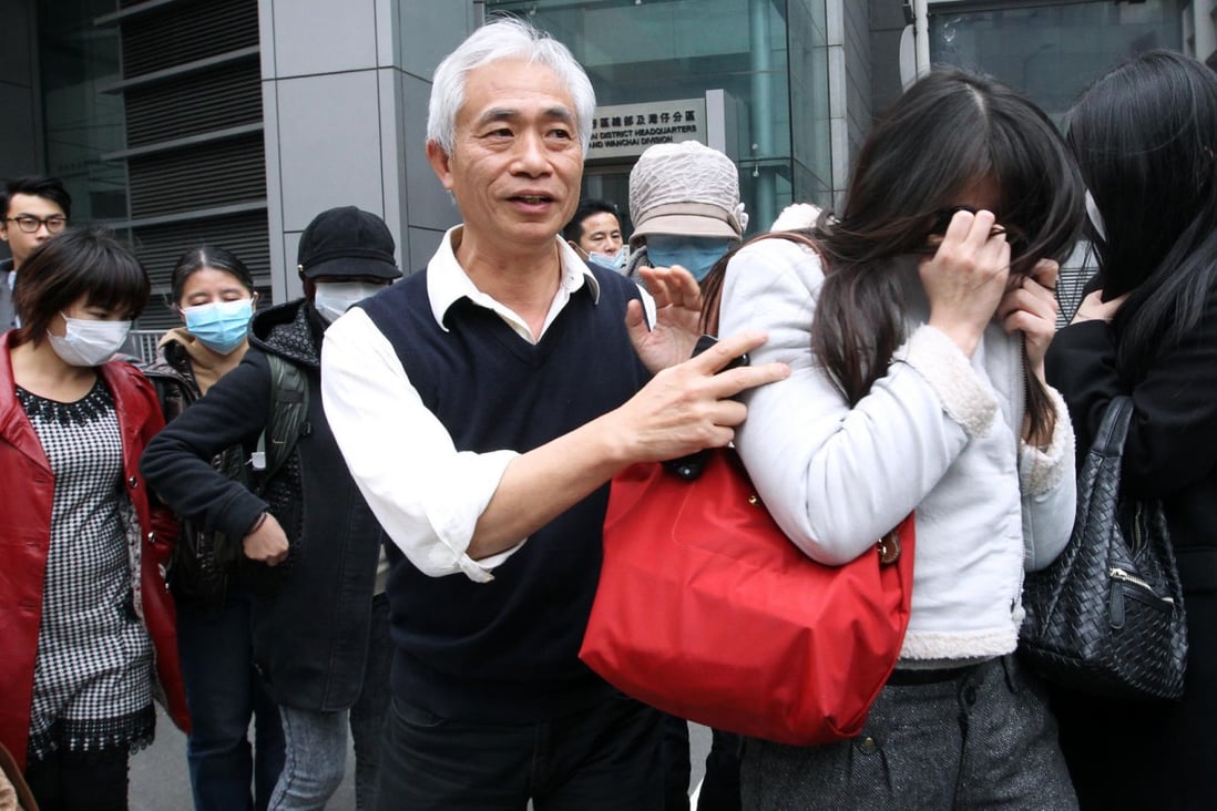 Leung Yiu-chung with investors at the Wan Chai police station.