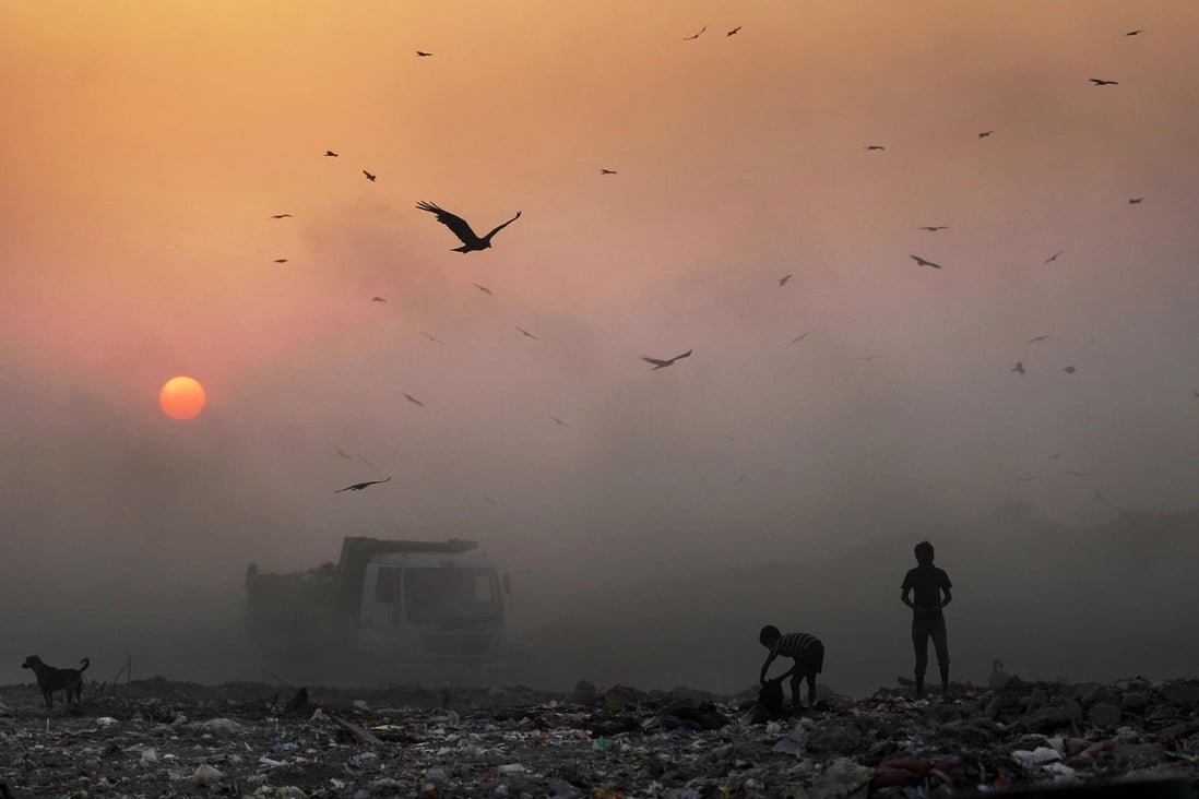 A thick smoky haze hangs over a dump in New Delhi. Photo: AFP