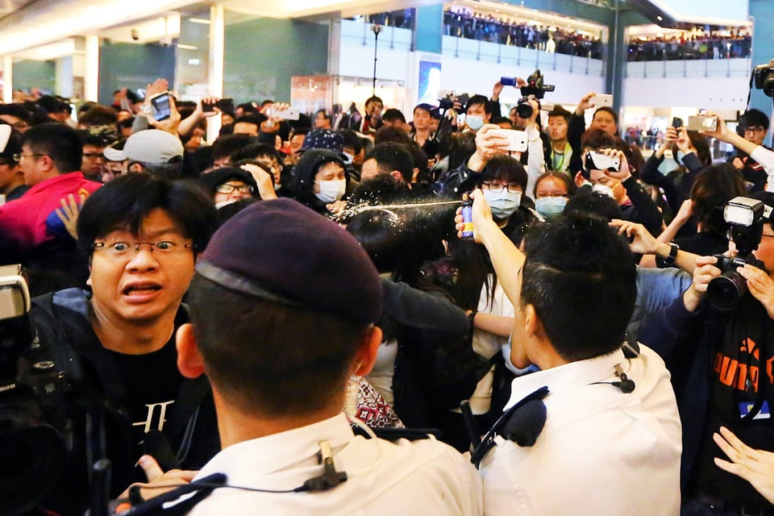 Protesters clash with police officers during a rally against parallel trading at New Town Plaza in Sha Tin on February 15. Photo: Felix Wong