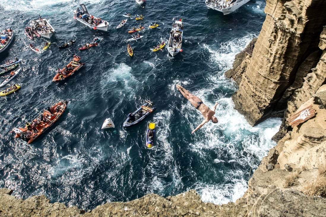 Professional diver David Colturi dives off a high cliff. Photos: Red Bull Media House; Thinkstock