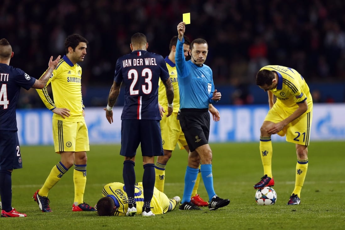 Referee Cuneyt Ckir finally tires of the treatment meted out to Eden Hazard and books Marco Verratti of Paris Saint-Germain during last week's Champions League tie. Photo: EPA