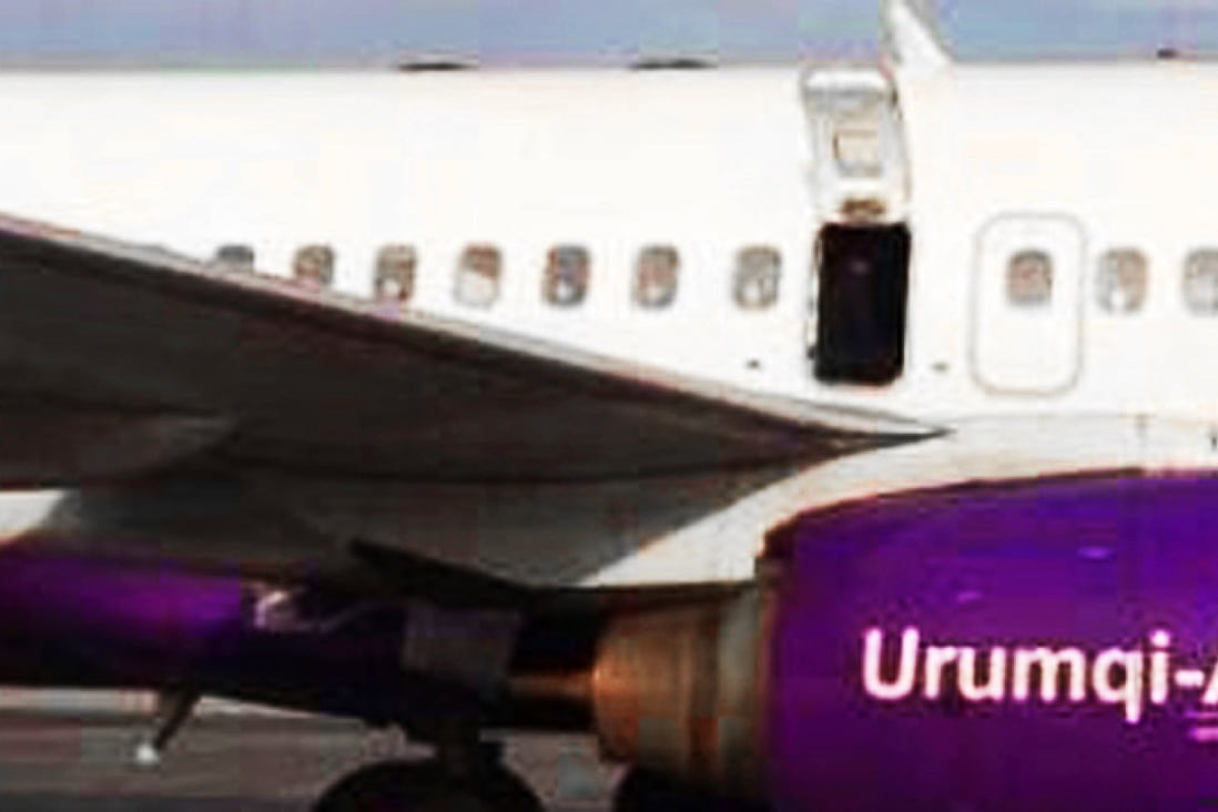 The door of China's Urumqi Airlines aircraft was opened just as the plane was preparing to take off on a domestic flight on Saturday. Photo: Yaxin.com