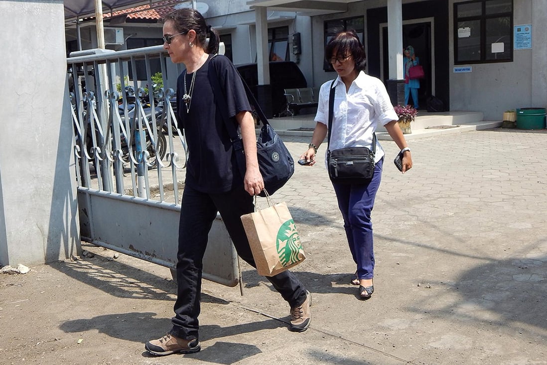 The cousin of Brazilian death row prisoner Rodrigo Gularte, leaves the outpost of Nusakambanga prison island, off central Java. An Indonesian court adjourned the latest legal bid by the two Australian drug smugglers, the ringleaders of the so-called "Bali Nine" drug trafficking gang. Photo: AFP