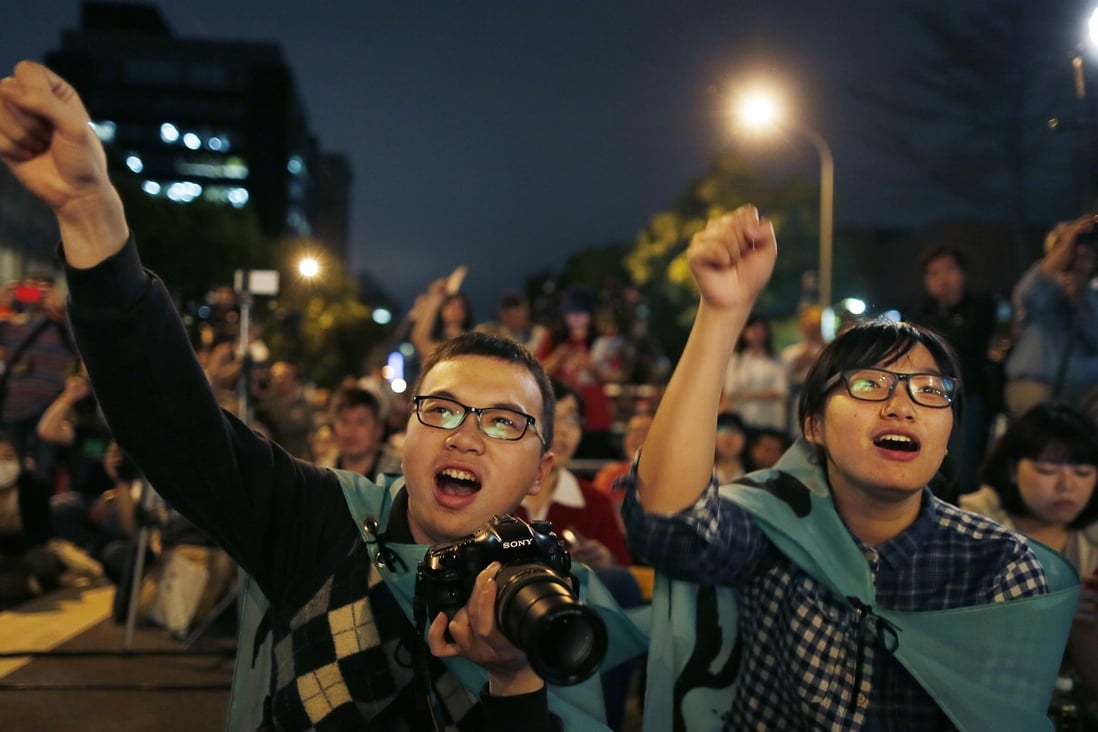 Taiwanese students gather in Taipei to mark the first anniversary of the Sunflower movement that has influenced the Occupy protests here. Photo: AP