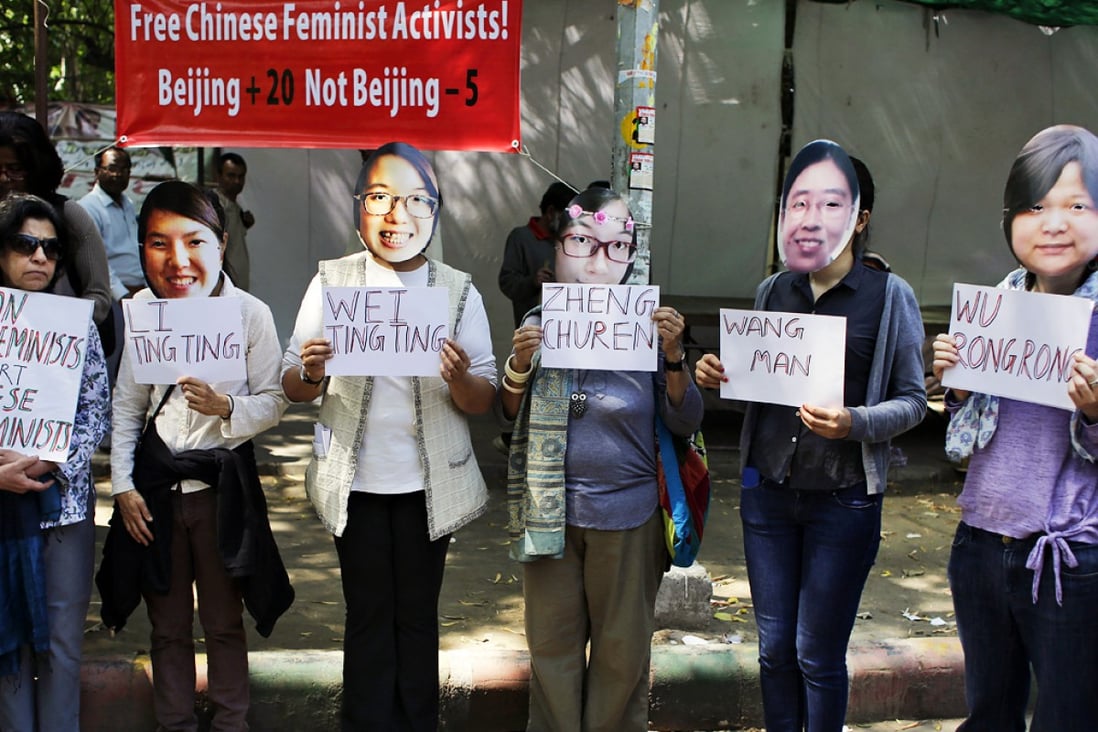 Indian women's rights activists, wearing masks of the five women detained by the Chinese government, demand their immediate release at a New Delhi rally. Photo: AP