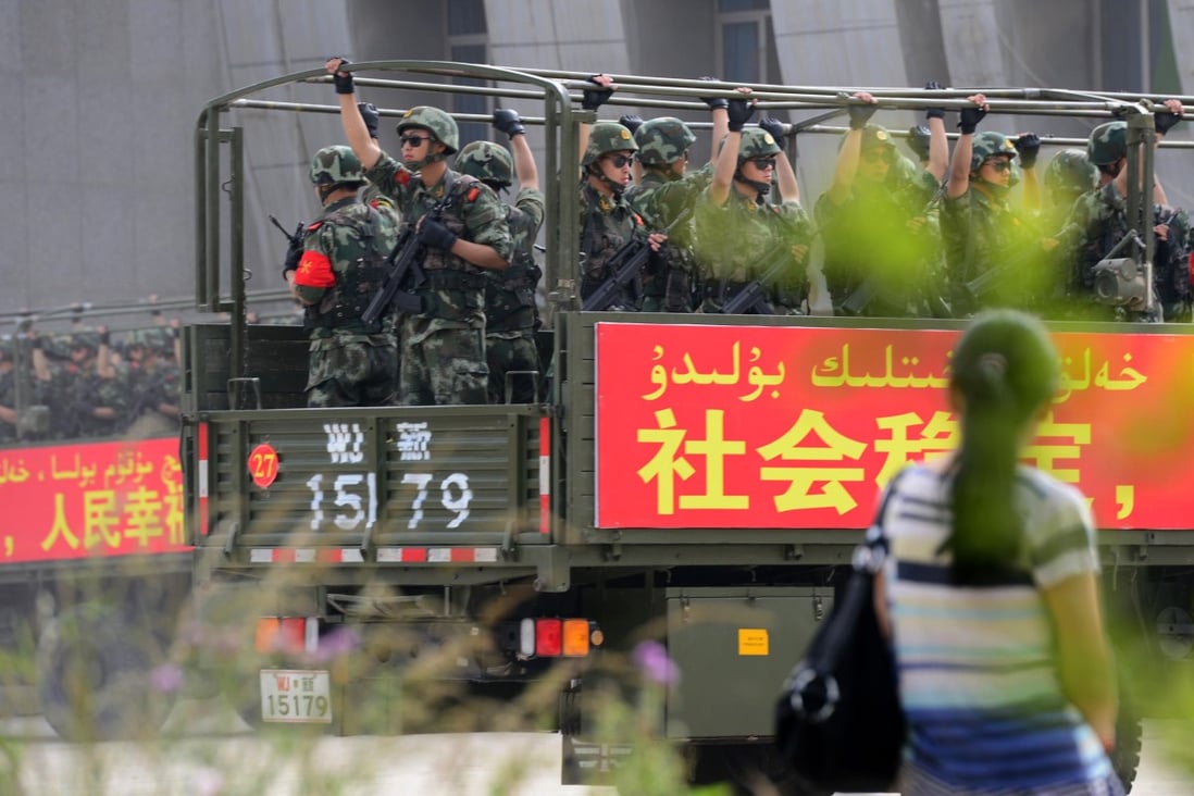 This picture taken in June 2014 shows government security forces participating in a military drill in Hetian, northwest China's Xinjiang region. Photo: AFP